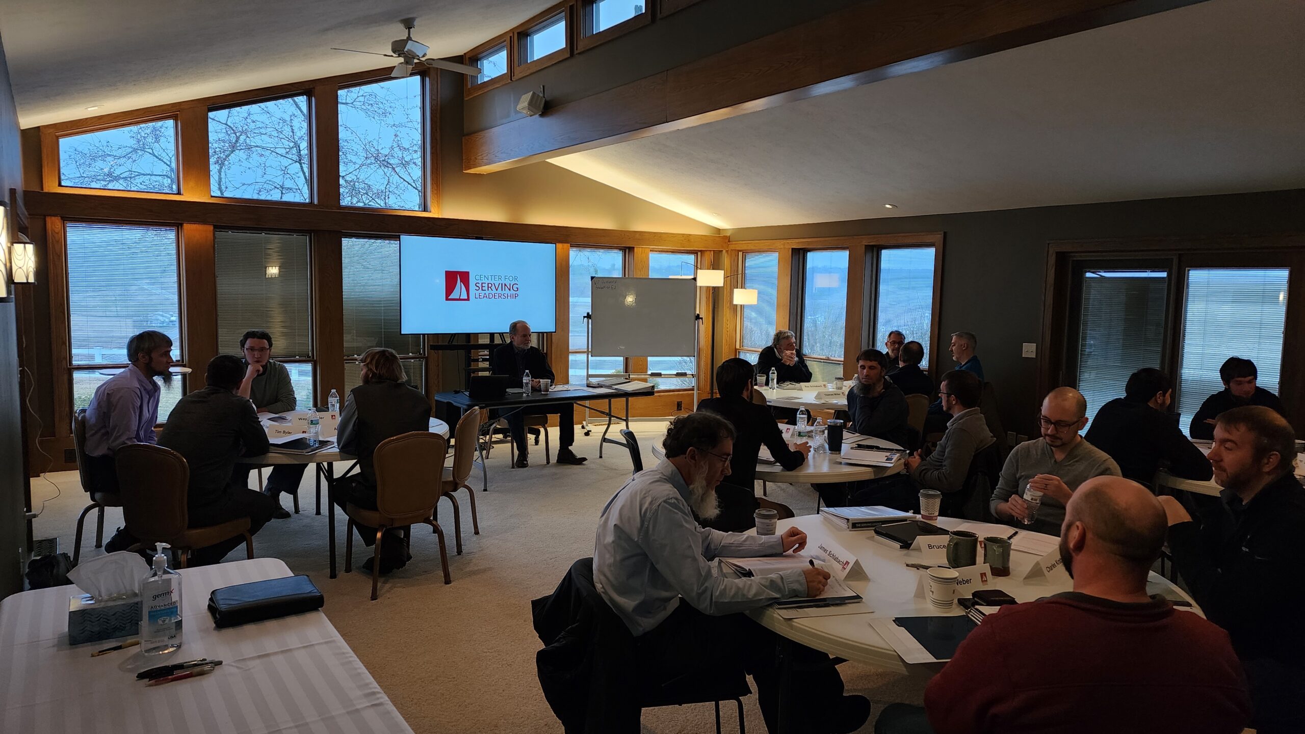 executive training session with people seated at multiple tables